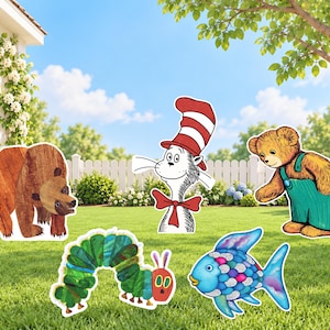May include: A collection of five decorative yard signs featuring a brown bear, a cat wearing a red and white striped hat with a red bow tie, a brown teddy bear in green overalls, a green caterpillar, and a blue fish with colorful scales.