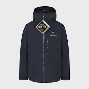 May include: A dark navy blue hooded jacket featuring a full-length front zipper, long sleeves, and multiple zippered pockets. The chest displays the white Arc'teryx logo and text, with a Gore-Tex product tag attached to the front zipper pull.