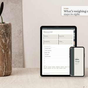 May include: A digital planner displayed on a tablet and smartphone screen, featuring a task list interface with the text "Follow Through" and "What's weighing on you stays in sight." The devices are positioned next to a tall, cylindrical marble vase.