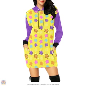 May include: A yellow hooded dress with a purple trim and a pattern of colourful stars with smiling faces.