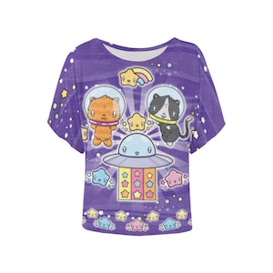 May include: Purple t-shirt with a cartoon design of two cats in spacesuits flying in a UFO. The UFO is surrounded by stars and a rainbow.