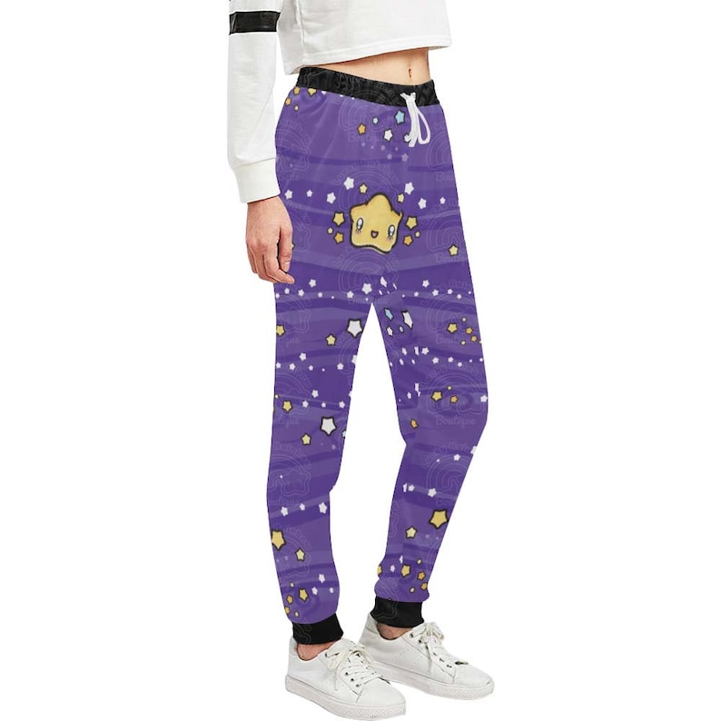 May include: Purple sweatpants with a whimsical pattern of stars and a cartoon star with a smiling face.