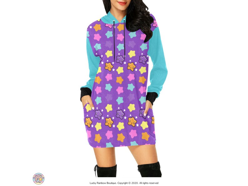May include: A purple hooded dress with a colourful star pattern. The stars have smiling faces and are in shades of pink, yellow, orange, and blue.