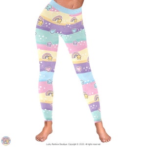 Pastel Rainbows, Hearts and Stars All over Print Leggings with a Wavy Rainbow Stripe Background.