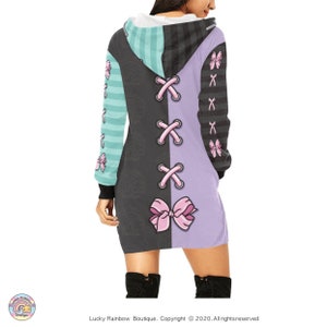 Pastel Pink Corset Bow hooded Sweatshirt with a Lilac and Grey Half and Half Background.
