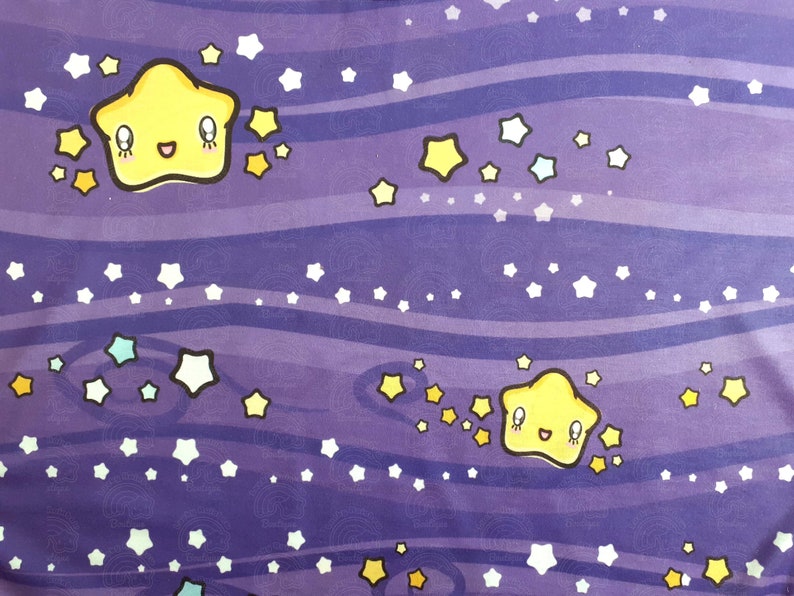 May include: Purple fabric with a repeating pattern of yellow stars with smiling faces and white stars. The background is a dark purple with wavy lines.