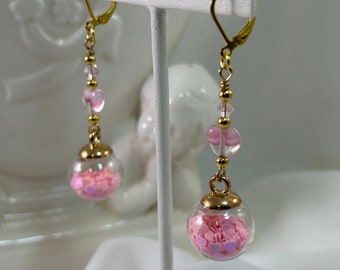 Pink Hearts Under Glass Dangling Bauble Earrings are made with Pink, Heart, Glitter-Filled Glass Baubles and Swirled Pink Glass Heart Beads