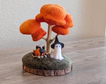 Needle felted Halloween ghost witch with bubbling cauldron and autumn tree.