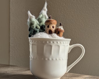 Felted winter teacup fairy house with snowy trees