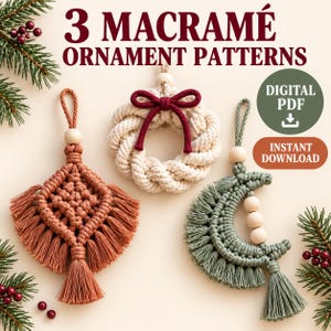 May include: Three macramé ornaments featuring a diamond shape in terracotta, a circular wreath with a dark red bow, and a crescent moon in sage green. Each ornament includes a wooden bead and a hanging loop. Text reads 3 MACRAMÉ ORNAMENT PATTERNS, DIGITAL PDF, and INSTANT DOWNLOAD.