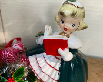 Vintage Napco Christmas Caroling Girl Planter, Holding Red Hymnal Book, Christmas Dress With Fur Muff, Kitschy Blonde, AX1690P8