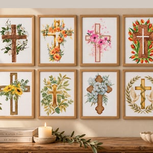 May include: A collection of eight framed cross-stitch patterns displayed in two rows. Each piece features a central cross motif adorned with various floral arrangements, including sunflowers, tulips, and roses, or symbols like white doves and greenery.