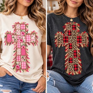 May include: Two short-sleeve t-shirts, one cream and one charcoal gray, each featuring a large cross graphic composed of patchwork squares with frayed edges. The cream shirt displays pink floral and gingham patterns, while the gray shirt shows leopard print and red plaid patterns.