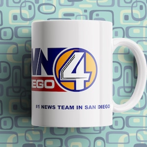 May include: White ceramic coffee mug with a blue, yellow, and red logo that says "News 4 San Diego" and the text "#1 News Team in San Diego".