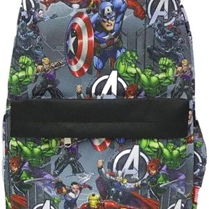 May include: A gray backpack with a colorful print of various Avengers characters, including Captain America, Iron Man, Hulk, and Thor. The backpack has a black zippered pocket on the front and a black strap.