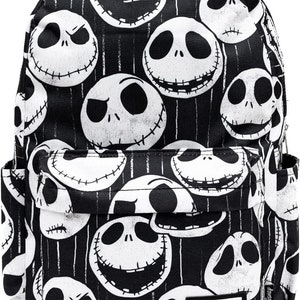 May include: Black canvas backpack with a repeating pattern of white Jack Skellington faces from the movie The Nightmare Before Christmas. The backpack has a black zipper and a black adjustable strap. The backpack has a small black label with the text "Disney's The Nightmare Before Christmas" on it.