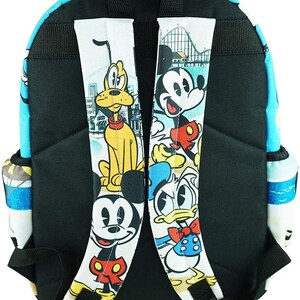 May include: A blue and white backpack with a black zipper and straps. The backpack features a cartoon image of Mickey Mouse, Donald Duck, and Pluto. The image is on a white background with a blue and white border.