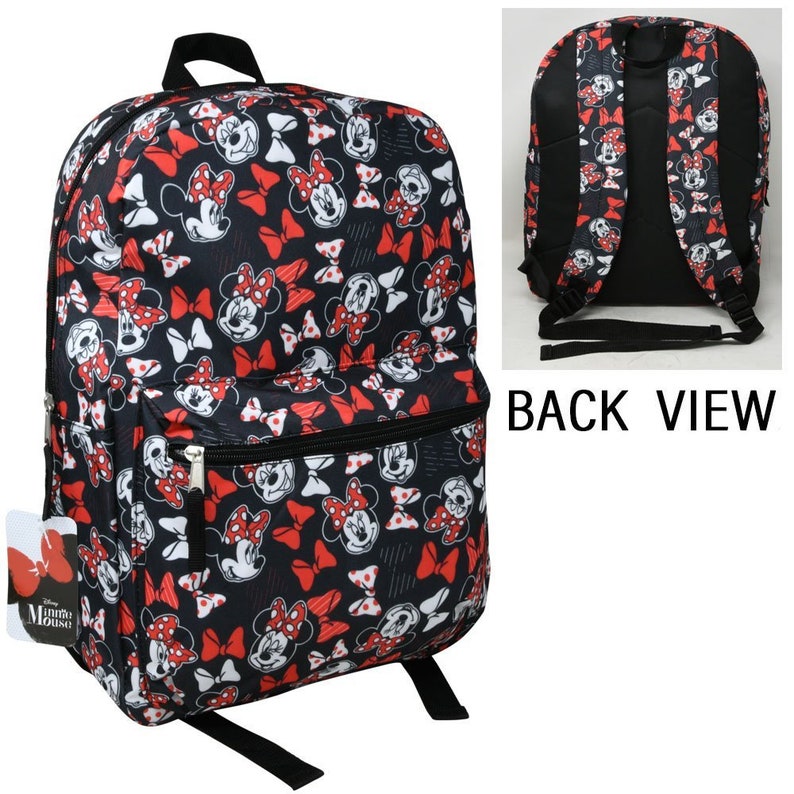 May include: Black backpack with a red and white Minnie Mouse print. The backpack has a large main compartment, a smaller front pocket, and adjustable straps. The back of the backpack is black. The text "Minnie Mouse" is on the front of the backpack.
