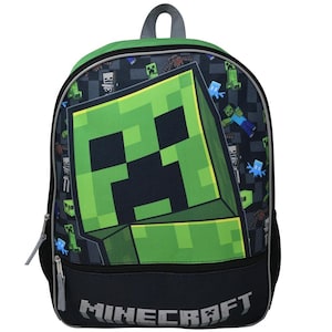 May include: A green and black Minecraft backpack with a large Creeper face on the front. The backpack has a black zipper and a gray pull tab. The text "MINECRAFT" is printed in gray on the bottom of the backpack.