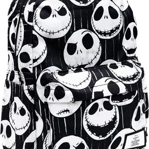 May include: Black backpack with a white and black pattern of Jack Skellington's face from The Nightmare Before Christmas. The backpack has a zippered pocket on the front and a small patch with the movie's logo.