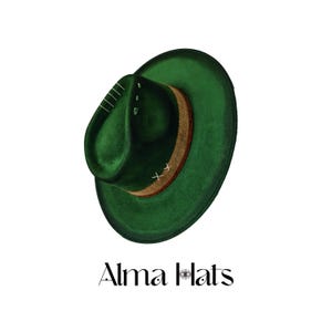 May include: A deep green fedora hat featuring a textured brown band around the crown, accented with white cross-stitch detailing and vertical line embroidery. The text Alma Hats is printed below the hat with an eye icon in the letter A.
