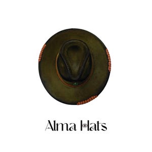 May include: An olive green fedora hat with a dark brown leather band and textured copper-colored accents along the brim. The hat features a pinched crown and a small green emblem on the band. Below the hat is the text Alma Hats.