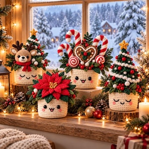 May include: Four crocheted festive decorations in cream-coloured pots with smiling faces. The set includes a reindeer with antlers, a gingerbread heart with candy canes, a bright red poinsettia, and a green Christmas tree with a yellow star.