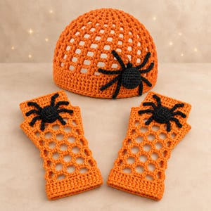 May include: A bright orange crochet beanie and a matching pair of fingerless gloves. Each piece features an open-weave mesh pattern and is decorated with a single, three-dimensional black crocheted spider attached to the surface of the fabric.