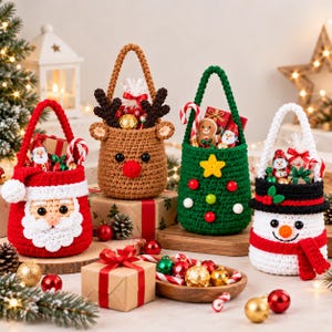 May include: Four crocheted holiday baskets featuring festive designs: a red Santa Claus, a brown reindeer with antlers, a green Christmas tree with ornaments, and a white snowman with a black hat and red scarf, all filled with assorted holiday treats.