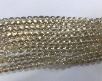 8mm round glass beads,  shiny, around 40 beads  champagne