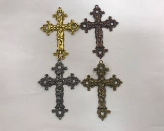 May include: Four ornate metal cross charms in gold, copper, silver, and black finishes. Each cross features intricate details and a floral design.