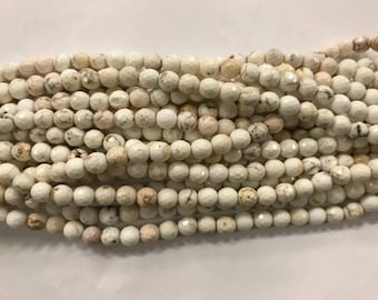 6mm round natural magnesite  beads, shiny, faceted, around 60 beads, cream
