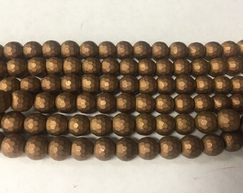10mm hematite round faceted beads , around 45beads