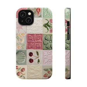 May include: A smartphone case featuring a grid of square tiles with various embossed designs including pink flowers, green leaves, red cherries, a seashell, and strawberries. The case displays a multi-colored pattern of pastel and vibrant tones.
