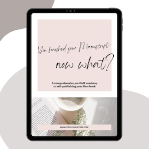 May include: A tablet displaying a digital guide titled You finished your Manuscript- now what? A comprehensive, no-fluff roadmap to self-publishing your first book. The screen shows a pale pink background, text, and a photo of a book and coffee.
