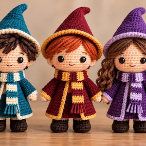 May include: Three handmade crochet dolls featuring pointed hats, scarves, and coats. The left doll wears teal, the center doll wears maroon and yellow, and the right doll wears purple. Each doll has dark eyes, a small smile, and distinct yarn hair.