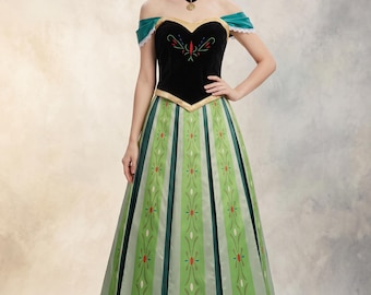 May include: A floor-length dress featuring a black velvet bodice with a sweetheart neckline, off-the-shoulder teal sleeves with white lace trim, and a green skirt with vertical panels decorated with a repeating floral pattern.