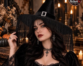 May include: A black witch hat featuring a tall pointed crown, a wide brim adorned with long black fringe, and a decorative band with a silver-toned rectangular buckle. The hat is made of a dark velvet-like material.