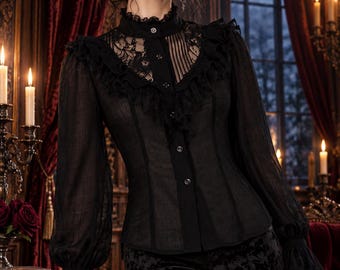 May include: A black long-sleeved blouse featuring a high lace collar, vertical pleats, and ruffled trim along the chest. The garment has a button-down front, sheer sleeves with ruffled cuffs, and is paired with black textured trousers.