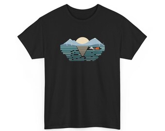 May include: A black short-sleeve t-shirt featuring a graphic print of a landscape with blue mountains, a pale yellow sun, and a body of water. The design includes a stylized white and orange boat floating on the water with a triangular reflection.