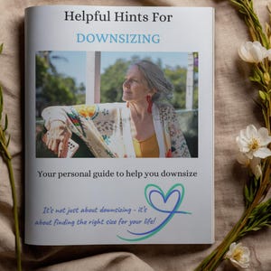 May include: A white booklet titled Helpful Hints For DOWNSIZING with a photograph of a person wearing a patterned cardigan and red earrings. The text reads Your personal guide to help you downsize and It's not just about downsizing - it's about finding the right size for your life! with a heart logo.