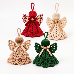 May include: Four crocheted angel ornaments in red, cream, beige, and dark green. Each angel features a round head, openwork wings, a flared skirt with a scalloped hem, a hanging loop on top, and a small satin ribbon bow at the neck.