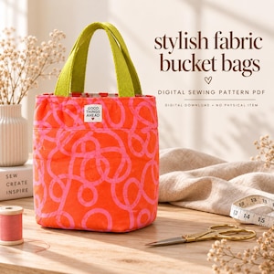 Könnte beinhalten: Eine Stoff-Beuteltasche mit leuchtend orangefarbener Basis, pinkem Kringelmuster und lindgrünen Henkeln. Ein kleines weißes Etikett auf der Vorderseite trägt die Aufschrift "GOOD THINGS AHEAD". Der Text "stylish fabric bucket bags" ist deutlich zu sehen.