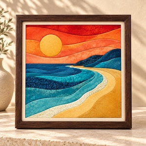 May include: A square framed fabric wall art piece featuring a layered landscape of a sunset over the ocean. The scene includes a yellow sun, orange and red sky, deep blue waves, and a sandy beach, all constructed with textured fabric pieces.