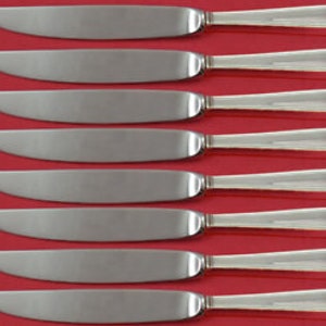 May include: Set of eight silver dinner knives with ornate handles.