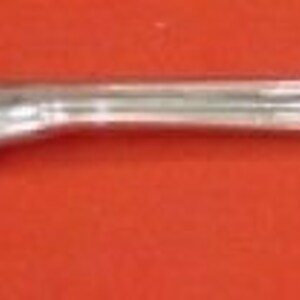 May include: A silver serving fork with a twisted handle and a rounded, slightly pointed end.
