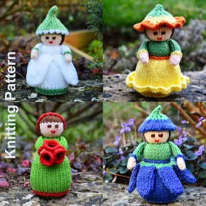 May include: Four hand-knitted dolls featuring flower-inspired designs. One wears a white dress with a green hat, another a yellow skirt with an orange-trimmed green hat, one holds red flowers in a green dress, and one wears a blue petal skirt.