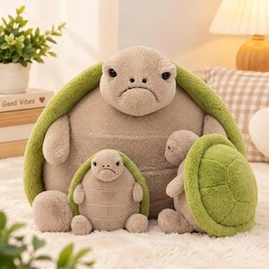 May include: A large plush turtle toy with a light brown body and a bright green shell, accompanied by two smaller plush turtles of the same design, all featuring soft, fuzzy textures and simple, stitched facial expressions.