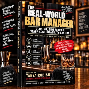 May include: A book titled The Real-World Bar Manager by Tanya Robish, featuring a black cover with gold and white text. The cover displays a bar scene with a glass of amber liquid, a cocktail shaker, and a list of management systems.
