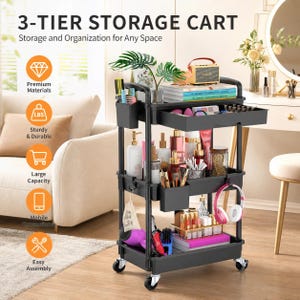 May include: A black 3-tier storage cart with wheels, featuring a top drawer, side hanging cups, and open shelves. The cart is filled with various beauty products, including bottles, brushes, a hair dryer, and headphones. Text reads 3-TIER STORAGE CART.